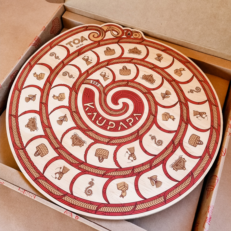 Kaupapa Game board -  spiral, latex printed spiral on NZ plywood  learn te reo Māori through play. kaupapa game kura rēhia māori language board game tākaro Māori takaro maimoa creative hemi kelly kuruho wereta rosie remmerswaal play language revitalisation photo: aroha tamihana